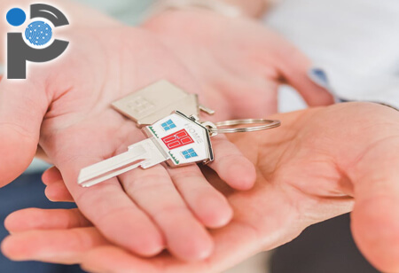 A landlord handing over their house keys