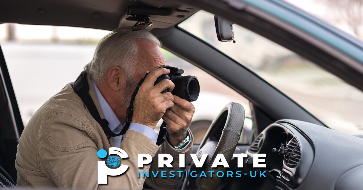 Private investigator taking photos from inside a car