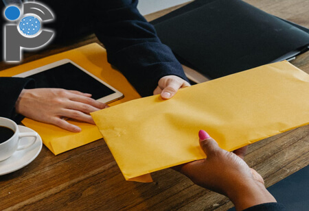 A process server handing over an envelope