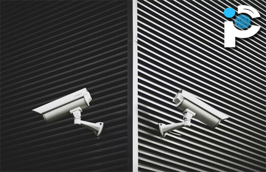 Two CCTV cameras fixed to either side of a building