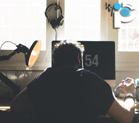 A man working at a desk from home